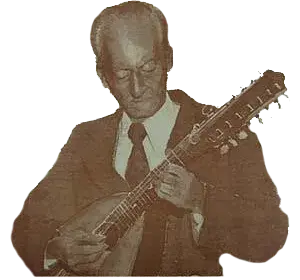 Mono Núñez interpretando música andina colombiana con instrumento de cuerda tradicional